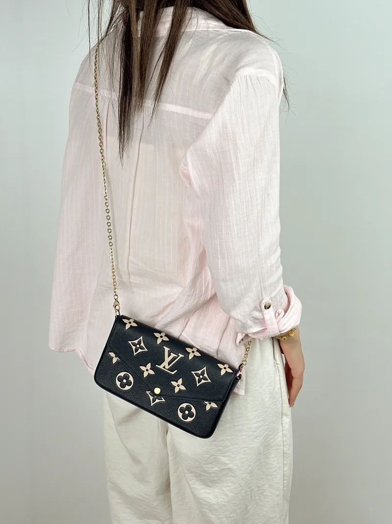 Louis Vuitton Crossbody Bag Pochette Félicie Black · White Calfskin Small 21 × 3 × 12 cm — on-model view 1 of 2