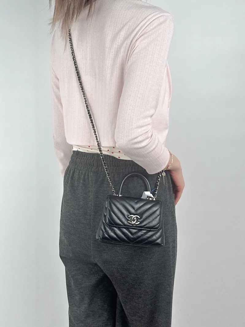 Chanel Crossbody Bag Coco Handle​Black V Calfskin Mini14.5 × 5.5 × 11.5 cm — on-model view 2 of 3