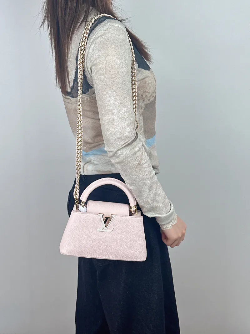 Louis Vuitton Top Handle Bag Capucines East West Pink Calfskinmini22 × 8 × 12 cm — on-model view 3 of 3