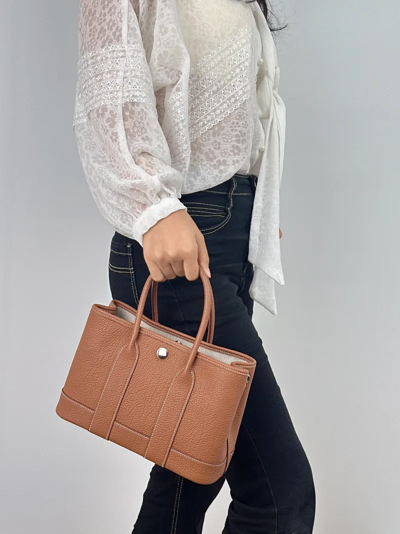 Hermès Top Handle Bag Neo Garden 23 Mini Negonda Calfskin Mini 23 × 10 × 16 cm W — on-model view 1 of 2