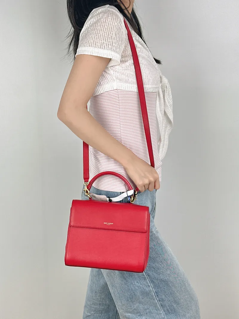 SAINT LAURENT Shoulder Bag Shoulder Bag Red Calfskin One Size21 × 10 × 17 cm — on-model view 1 of 3