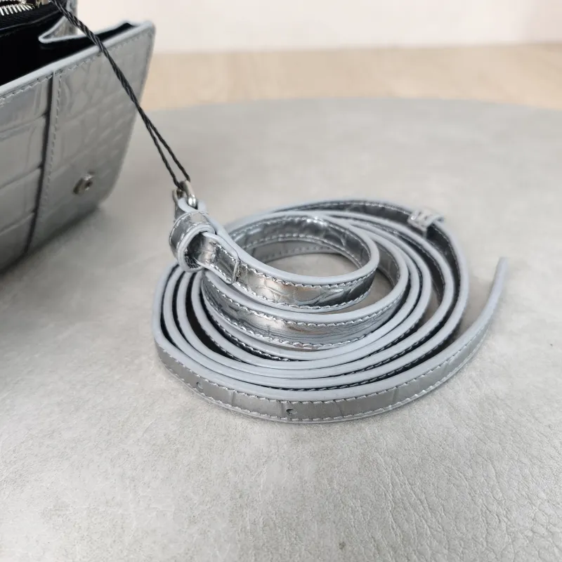 BALENCIAGA Crossbody Bag WOC Crossbody Bag Silver Calfskin One Size 19.5 × 3 × 10 cm — detail view 1 of 13