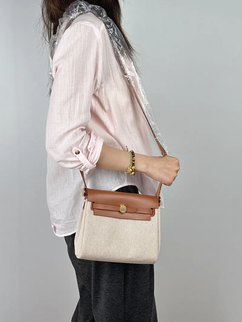 Hermès Crossbody Bag Herbag Zip 20 Beige Brown Calfskin，Canvas Mini 20.5 × 7 × 16.5 cm G — on-model view 1 of 2