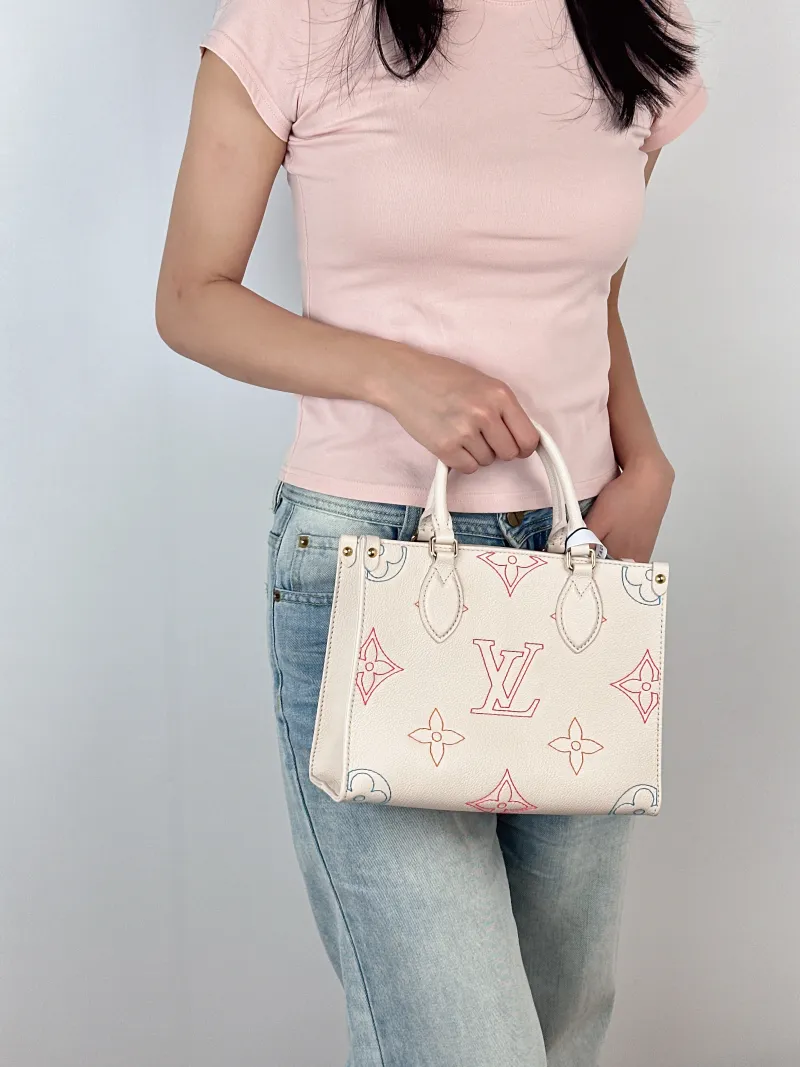 Louis Vuitton Top Handle Bag Onthego White · Embroidered Calfskin Small25 × 11.5 × 19 cm — on-model view 3 of 3