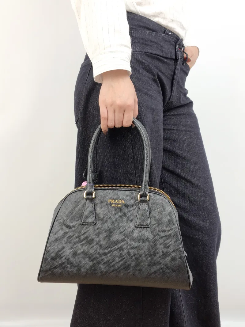 PRADA Top Handle Bag Saffiano Black Calfskin One Size 31.5 × 11 × 20 cm — on-model view 1 of 2