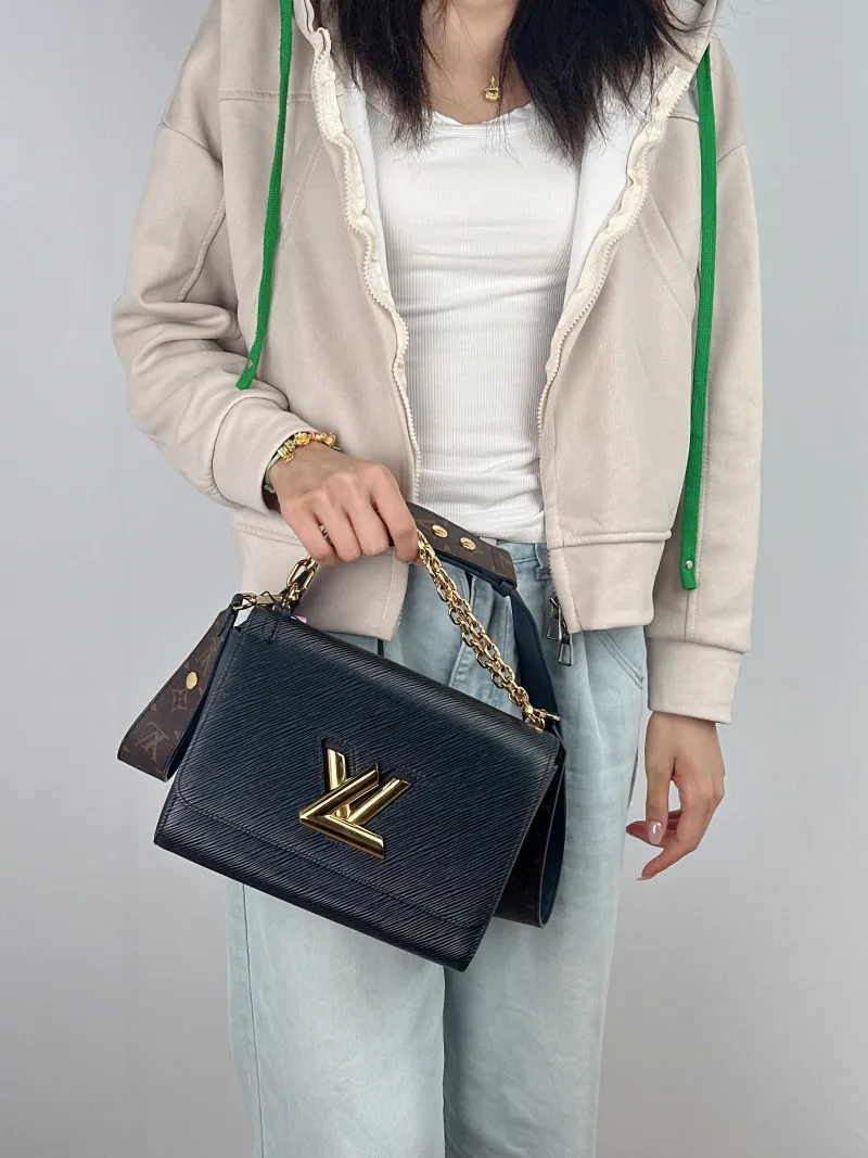 Louis Vuitton Crossbody Bag Twist Black Epi Embossed Calfskin Medium 23 × 9.5 × 17 cm — on-model view 1 of 2