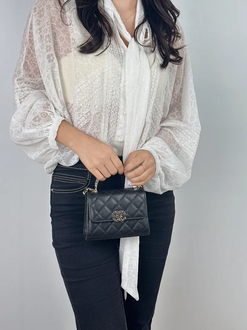 Chanel Crossbody Bag kelly Black Grained Calfskin nano 15 × 5 × 11 cm — on-model view 1 of 2