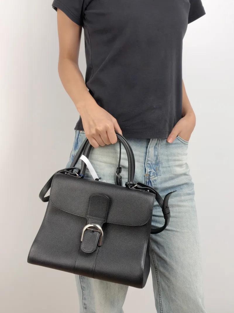 DELVAUX Top Handle Bag Brillant Black Calfskin Medium 29 × 15 × 22 cm — on-model view 2 of 3