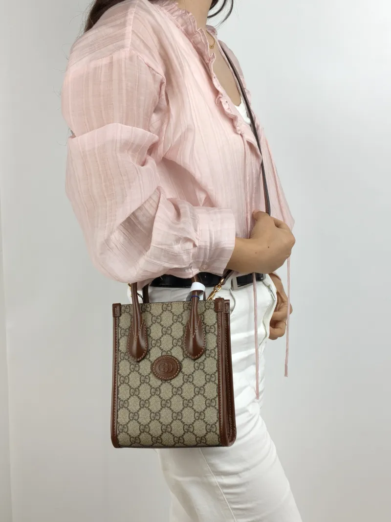 GUCCI Crossbody Bag GG Retro Collection Tote Bag Brown PVC Mini 16 × 7 × 20 cm — on-model view 1 of 2