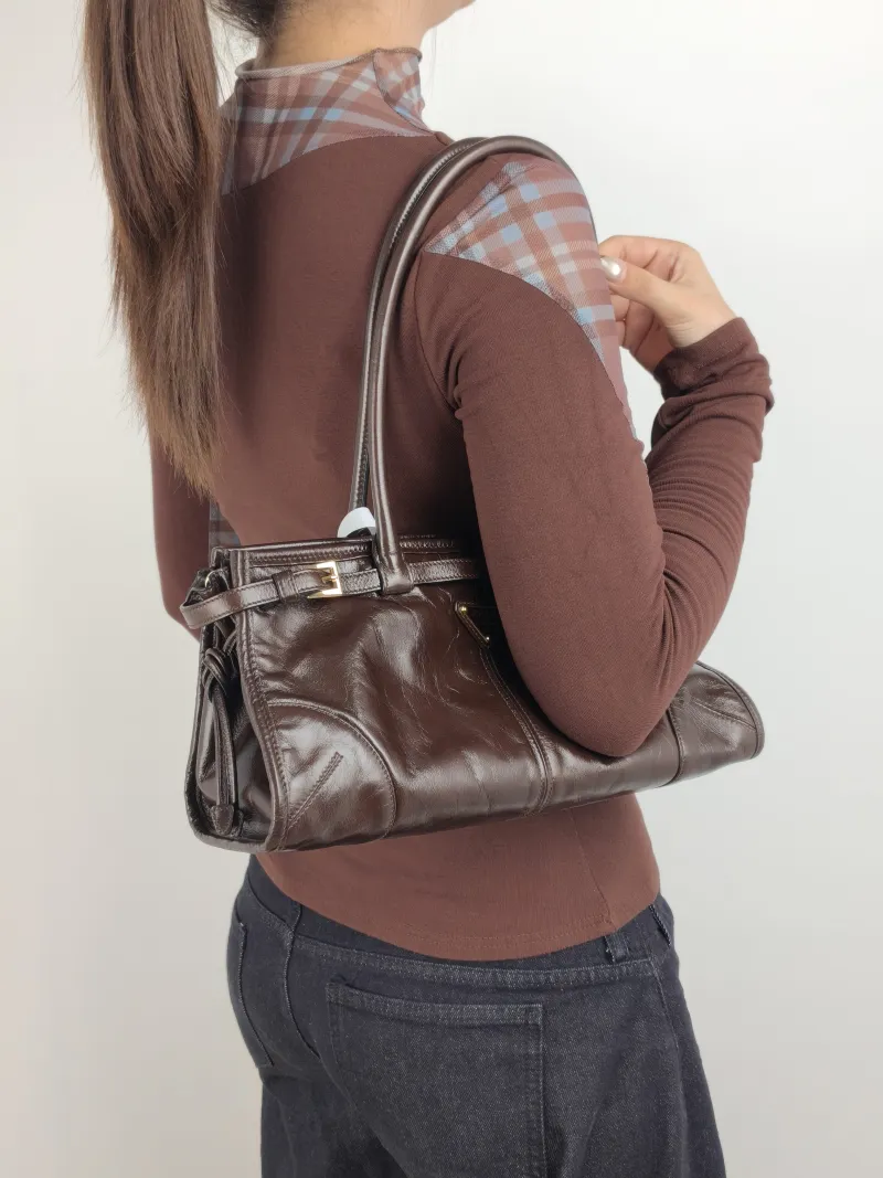 PRADA Shoulder Bag Bonnie Soft Lux Waxed Leather Medium 32 × 12 × 15.5 cm — on-model view 1 of 2