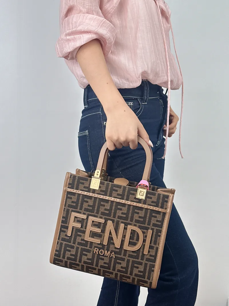 FENDI Crossbody Bag Sunshine Shopping Tote Monogram Canvas Small 25.5 × 12 × 22.5 cm — on-model view 1 of 2