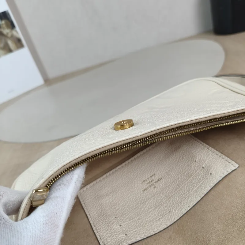 Louis Vuitton Crossbody Bag IVY White Monogram Empreinte Embossed Calfskin Small 23.5 × 4.3 × 12 cm — detail view 1 of 11