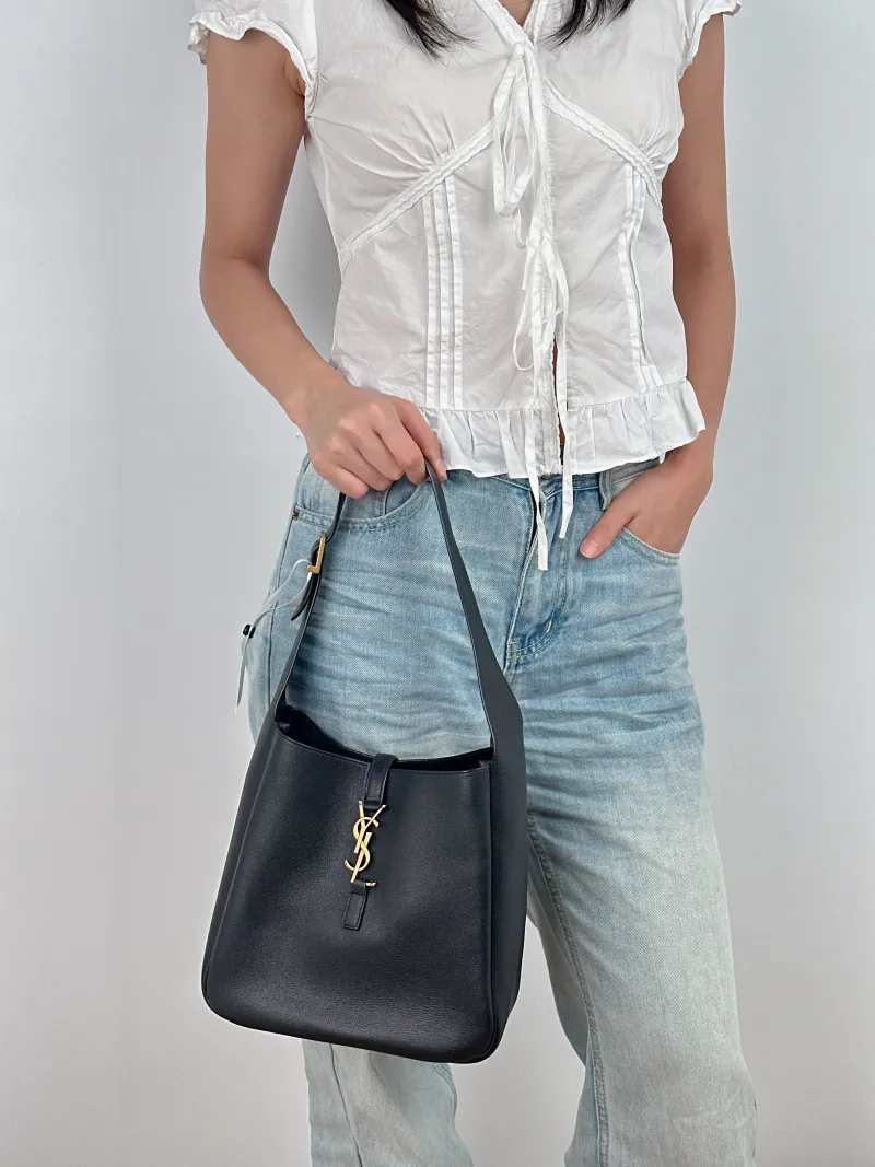 SAINT LAURENT Shoulder Bag LE 5 À 7 Hobo Black Calfskin Small 22 × 8.5 × 23 cm — on-model view 2 of 2