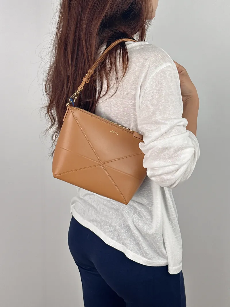 LOEWE Shoulder Bag puzzle fold Shoulder Bag Brown Calfskin One Size 23 × 6.5 × 15.5 cm — on-model view 2 of 2
