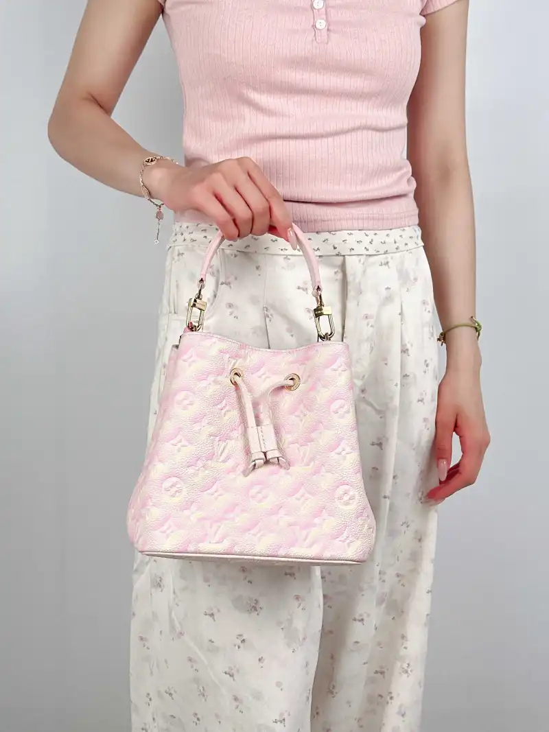 Louis Vuitton Crossbody Bag NÉONOÉ Bucket Bag BB Collection · Calfskin BB 20 × 13 × 20 cm — on-model view 1 of 3