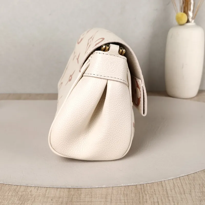 Louis Vuitton Crossbody Bag Favorite White · Pink Empreinte Embossed Calfskin Monogram Medium24 × 9 × 14 cm — detail view 1 of 12