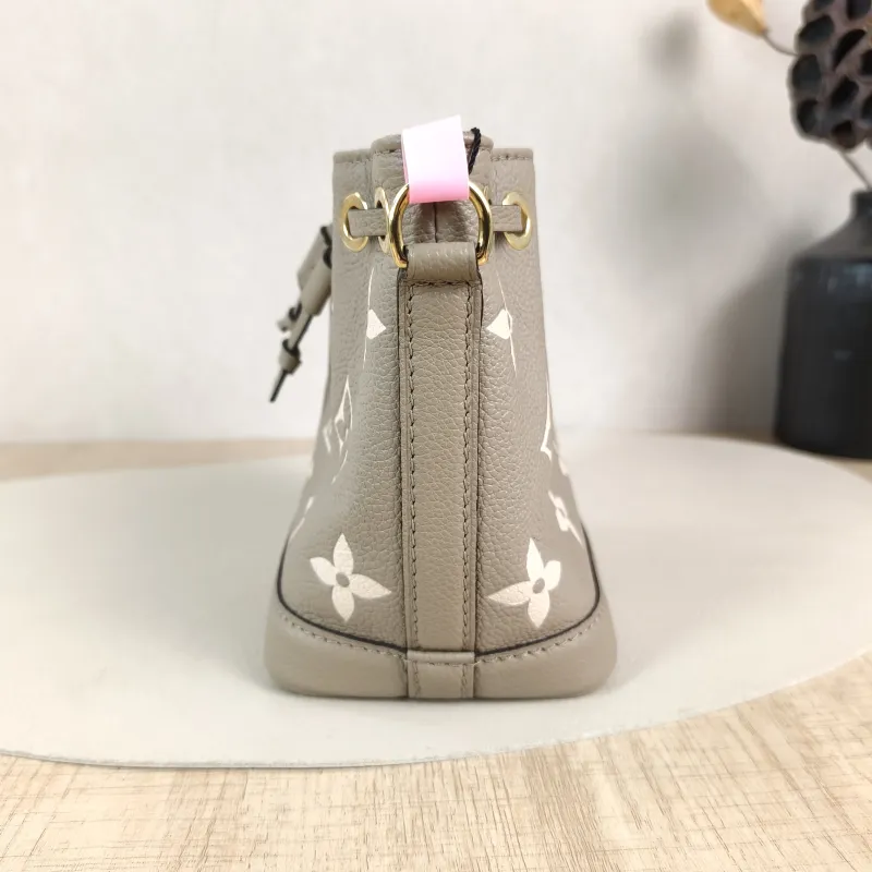 Louis Vuitton Crossbody Bag NANO NOÉ Bucket Bag Nano · White Empreinte Embossed Calfskin nano 13 × 10 × 16 cm — detail view 1 of 10