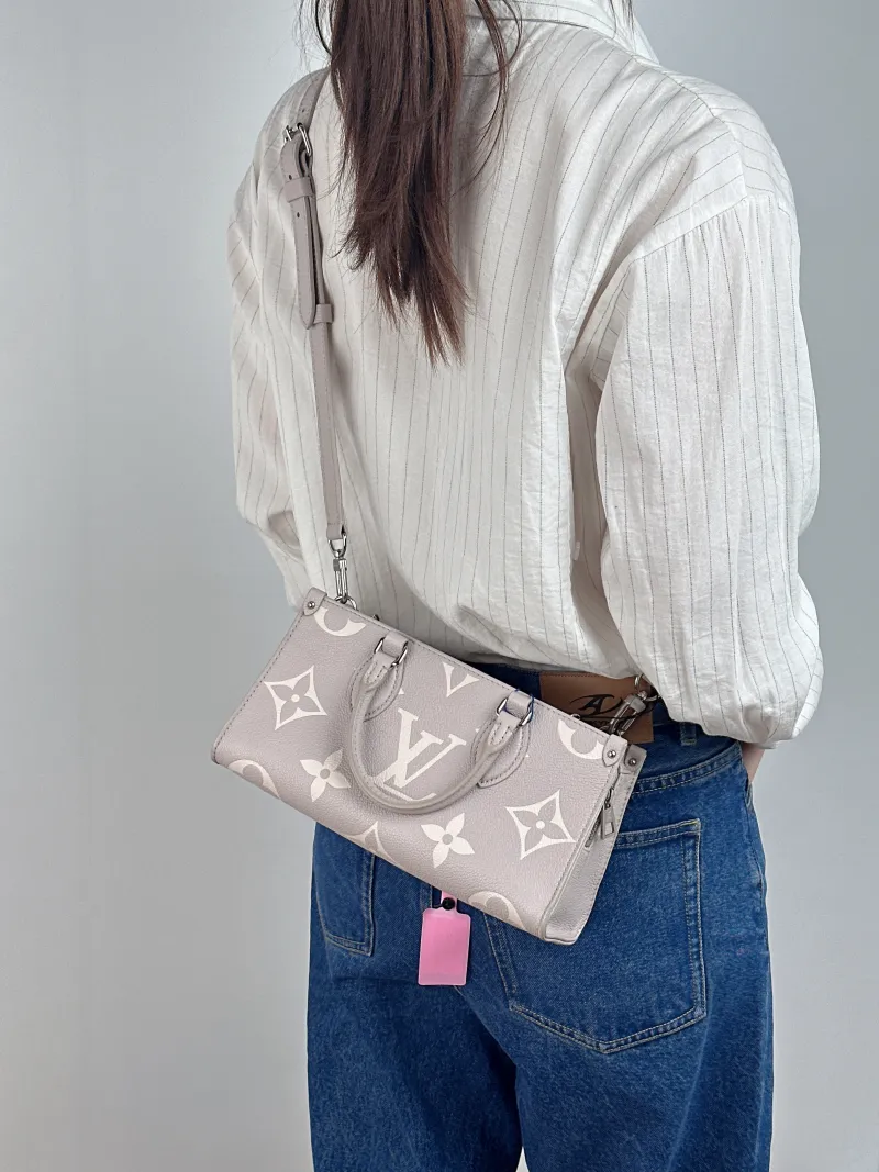 Louis Vuitton Crossbody Bag Onthego East West Two Straps Grey Monogram Empreinte Embossed Calfskin Small 25 × 10 × 13 cm — on-model view 3 of 3