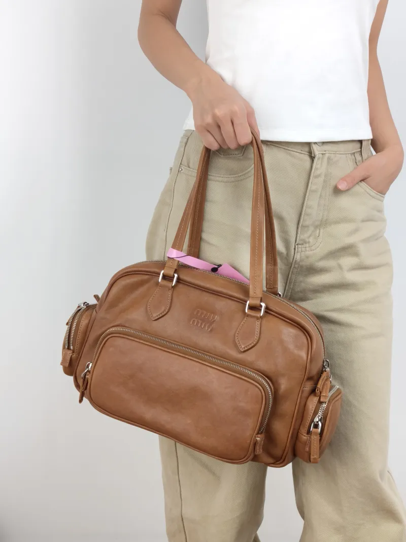 Miumiu Top Handle Bag Pocket Top Handle Bag Caramel SL ambskin One Size 32 × 14 × 22 cm — on-model view 1 of 2