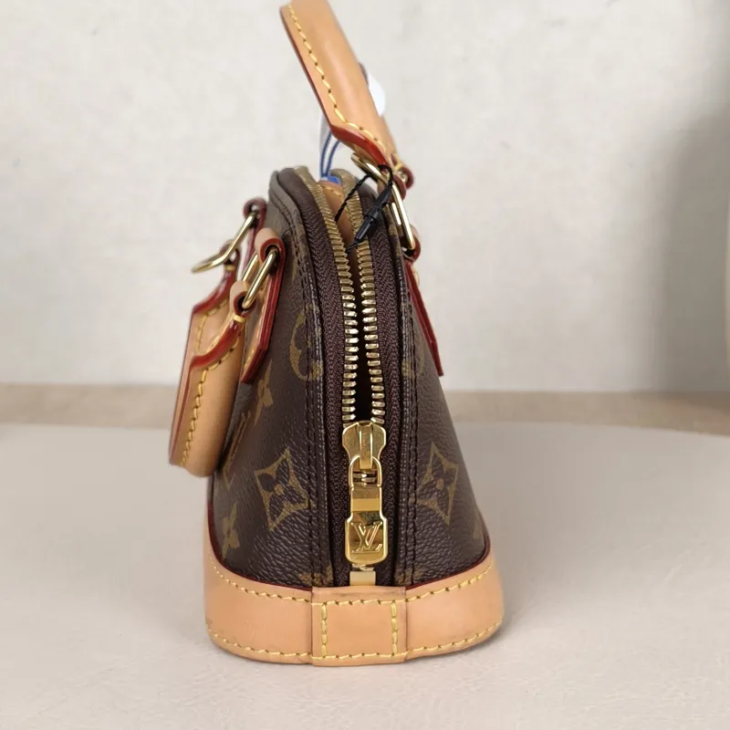 Louis Vuitton Crossbody Bag Alma Nano Monogram PVC nano 18 × 8 × 12 cm — detail view 7 of 9