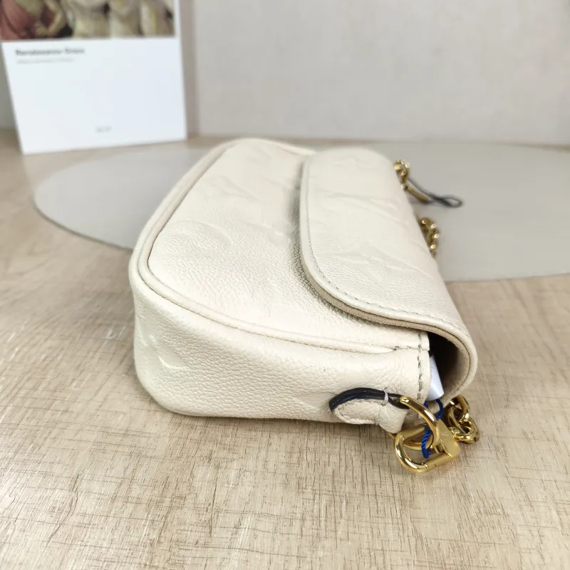 Louis Vuitton Crossbody Bag IVY White Monogram Empreinte Embossed Calfskin Small 23.5 × 4.3 × 12 cm — detail view 3 of 11