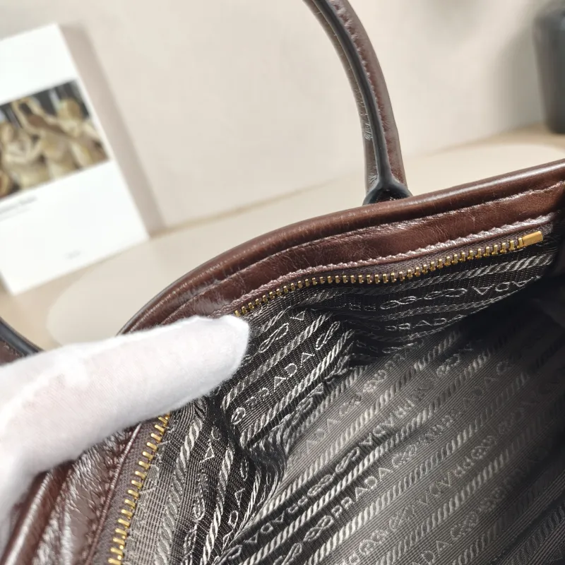 PRADA Top Handle Bag Bonnie Soft Lux Brown Waxed Leather Mini 23.5 × 9 × 12 cm — detail view 12 of 13
