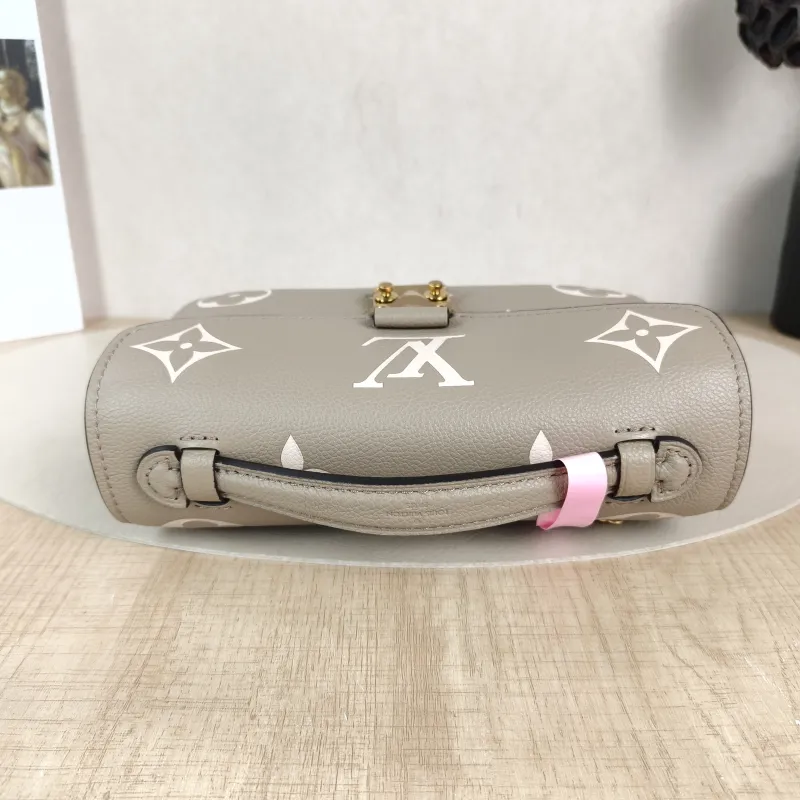 Louis Vuitton Crossbody Bag Pochette Métis East West Monogram Empreinte Embossed Calfskin Small 21.5 × 6 × 13.5 cm — detail view 9 of 13