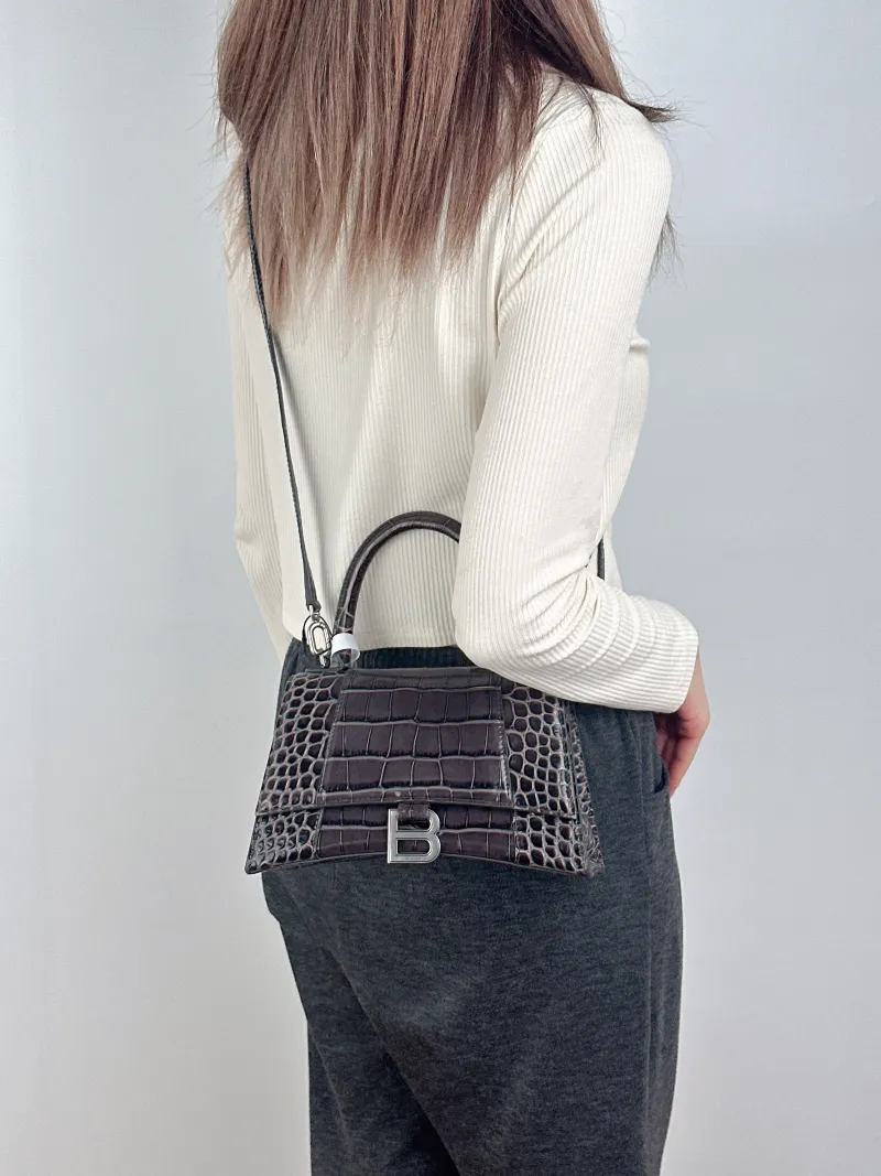 BALENCIAGA Crossbody Bag Hourglass Hourglass Bag Green Calfskin Small23 × 10 × 14 cm — on-model view 1 of 3