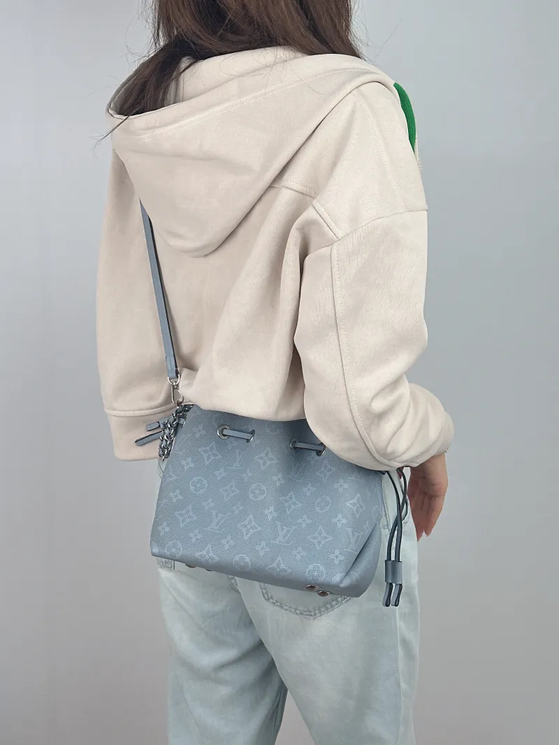 Louis Vuitton Crossbody Bag BELLA Blue Calfskin 22 × 14 × 20 cm — on-model view 2 of 3