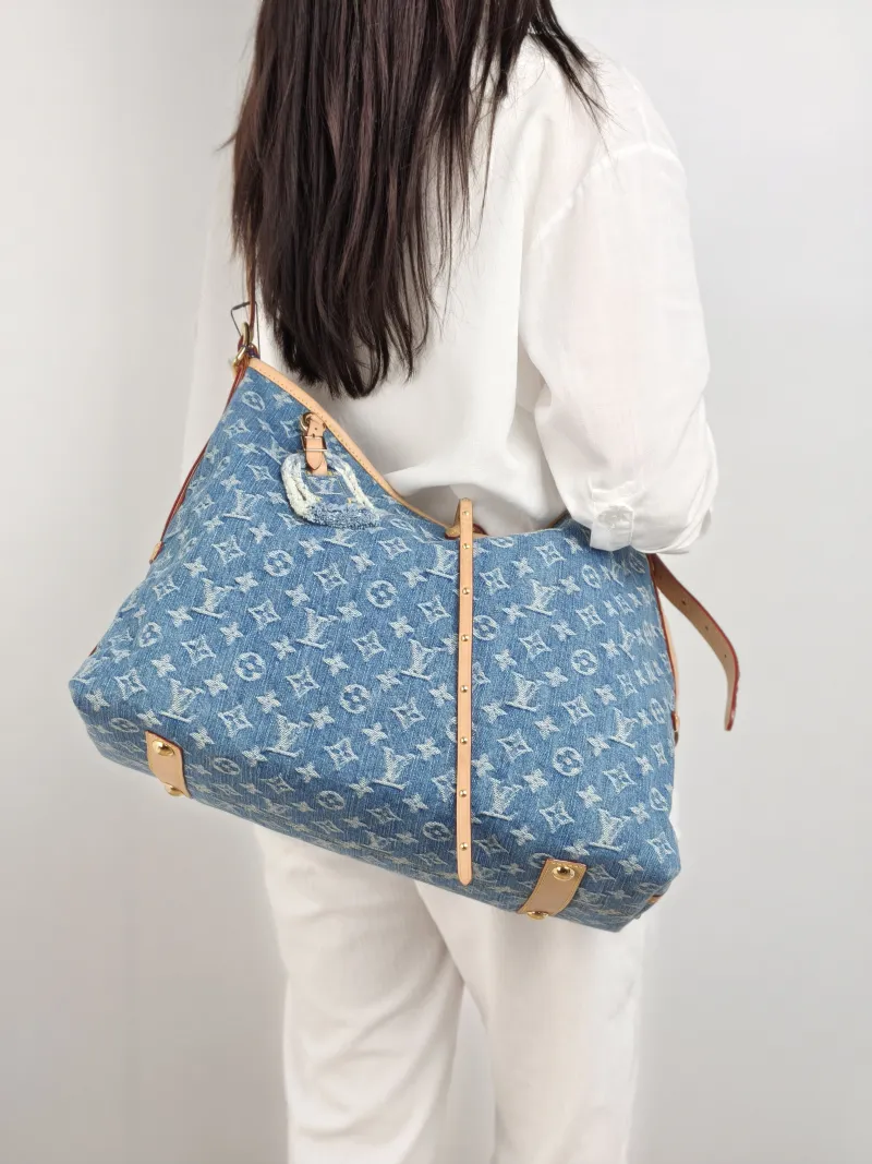 Louis Vuitton Crossbody Bag Carryall Blue Medium 39 × 15 × 30 cm — on-model view 1 of 2