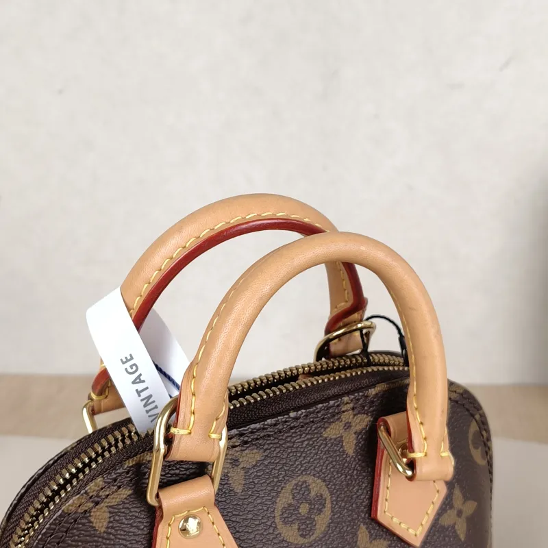 Louis Vuitton Crossbody Bag Alma Nano Monogram PVC nano 18 × 8 × 12 cm — detail view 6 of 9