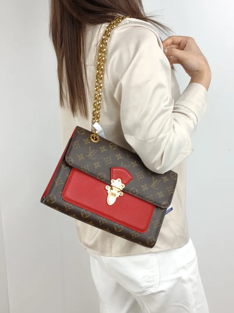 Louis Vuitton Crossbody Bag VICTOIRE Red PVC · Calfskin One Size 27 × 10 × 17 cm — on-model view 1 of 2