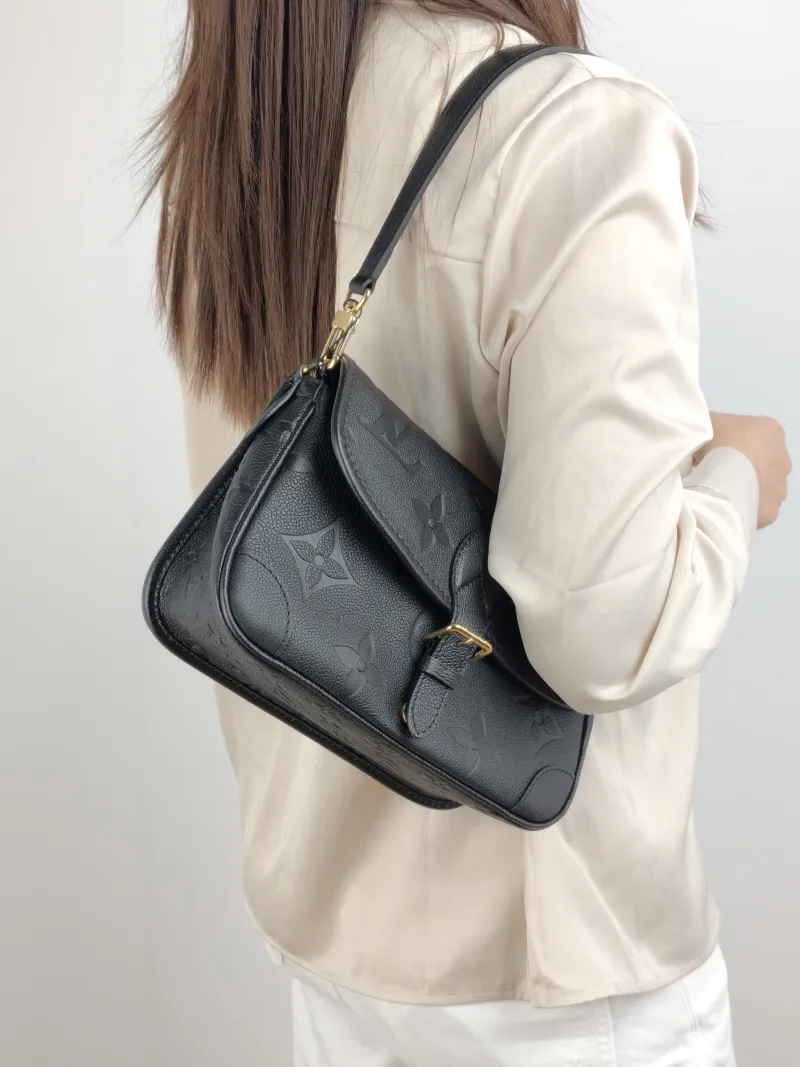 Louis Vuitton Crossbody Bag Diane Baguette Bag Black Monogram Empreinte Embossed Calfskin Small 24 × 9 × 15 cm — on-model view 1 of 2