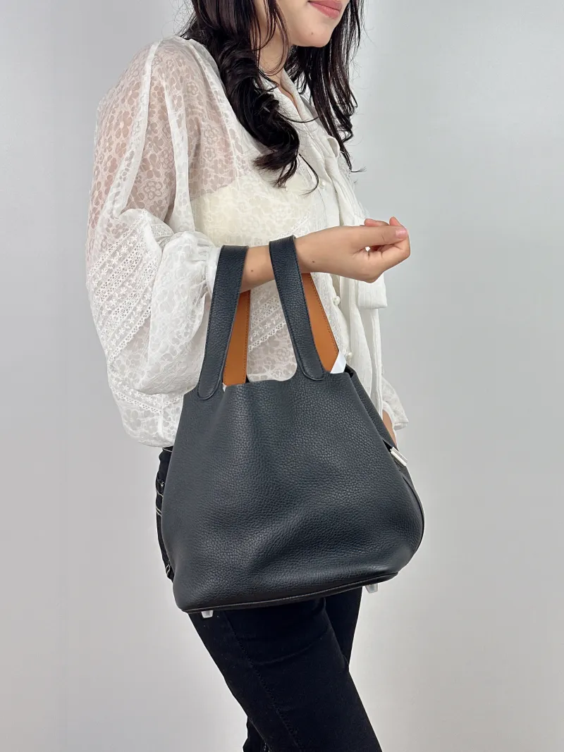 Hermès Top Handle Bag Picotin Lock 22 22 Black Colorblock Taurillon Clemence TC Calfskin Medium 22 × 18 × 21 cm A — on-model view 1 of 2