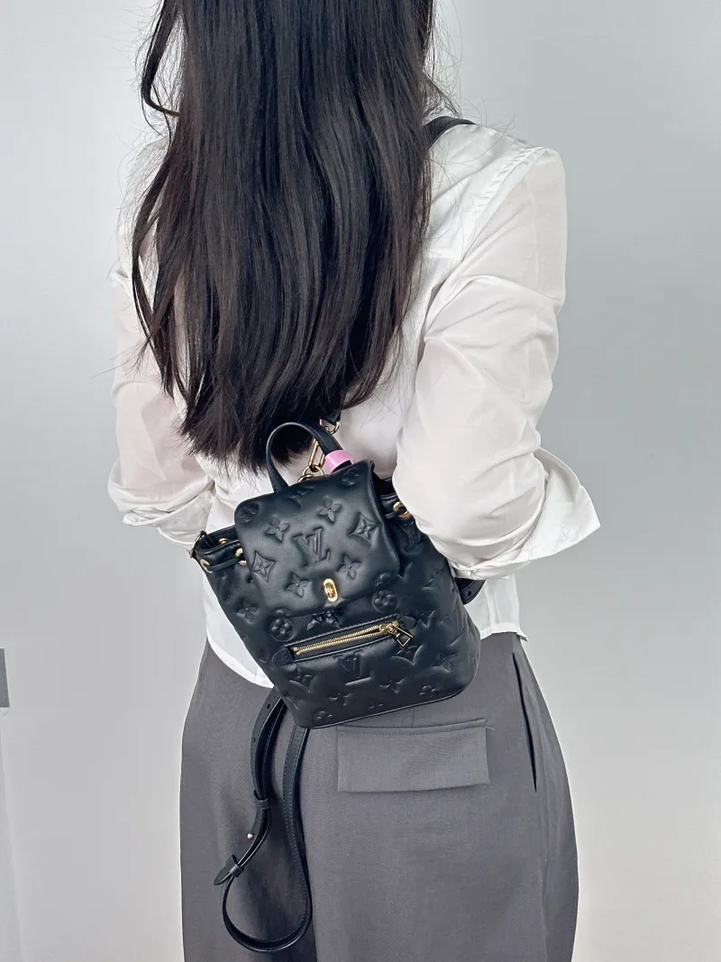 Louis Vuitton Backpack Coussin Backpack Black with Gold-Tone Hardware Lambskin Mini 15 × 7.5 × 20 cm — on-model view 2 of 2