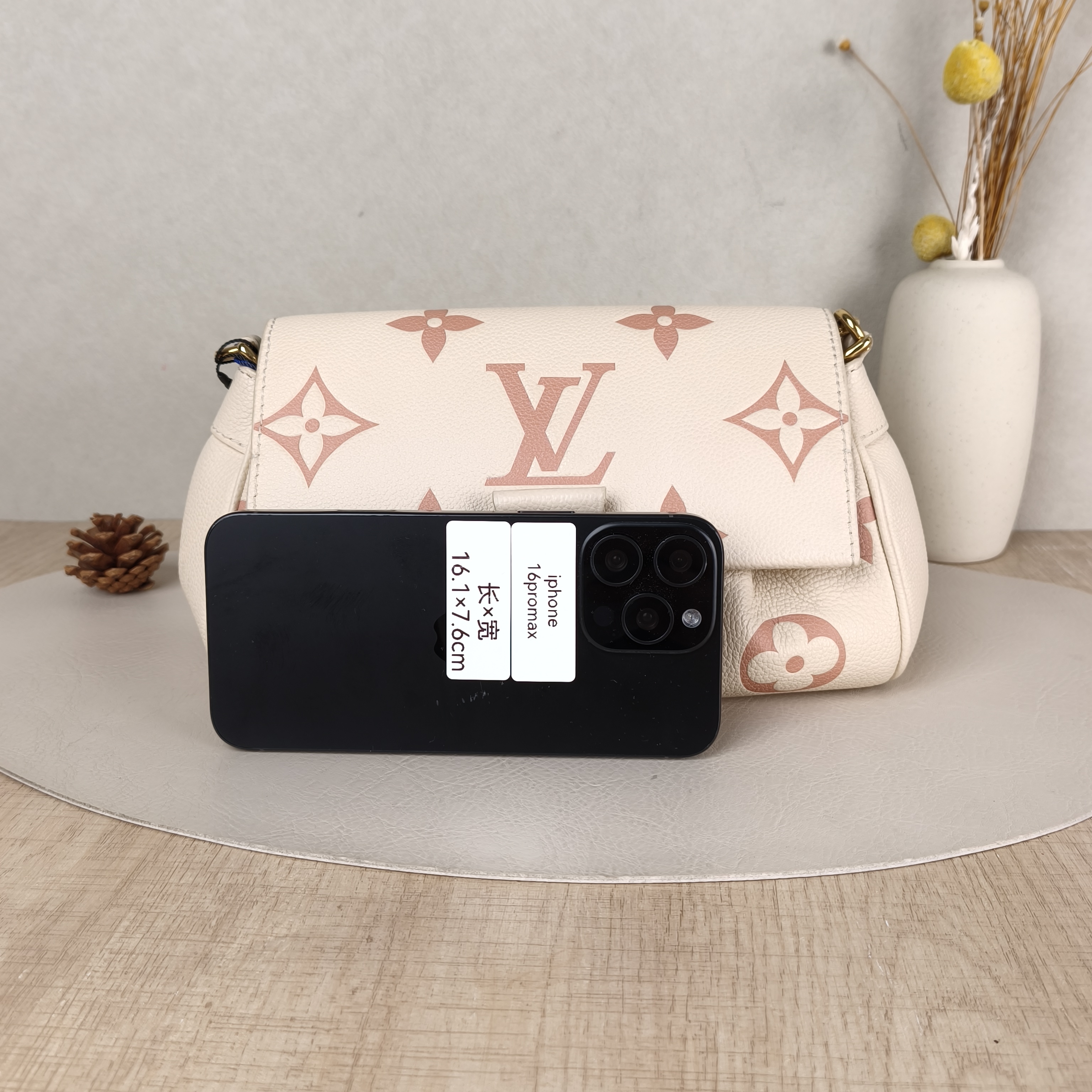 Louis Vuitton Crossbody Bag Favorite White · Pink Empreinte Embossed Calfskin Monogram Medium24 × 9 × 14 cm — cover view 2 of 6