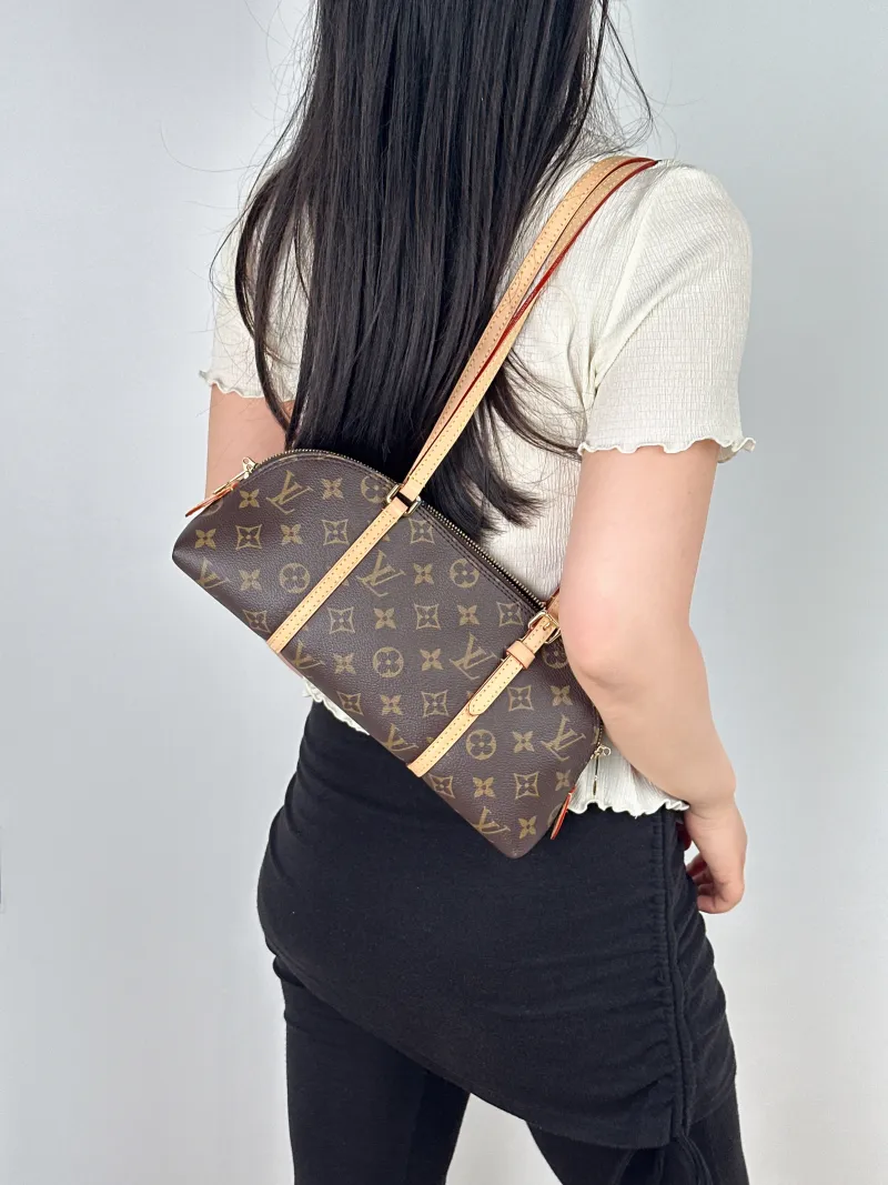Louis Vuitton Shoulder Bag Squire East West Monogram PVC One Size29 × 8 × 14 cm — on-model view 1 of 2