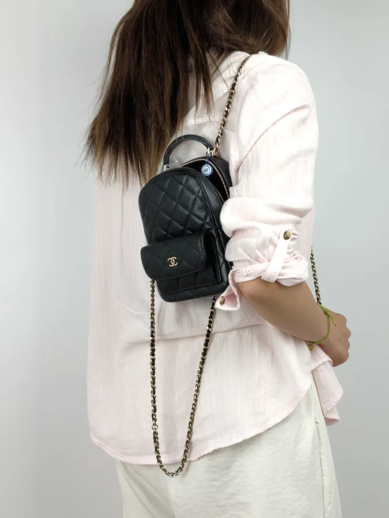 Chanel Backpack mini Backpack Collection Black with Gold-Tone Hardware Grained Calfskin One Size 13 × 9 × 18 cm — on-model view 1 of 3