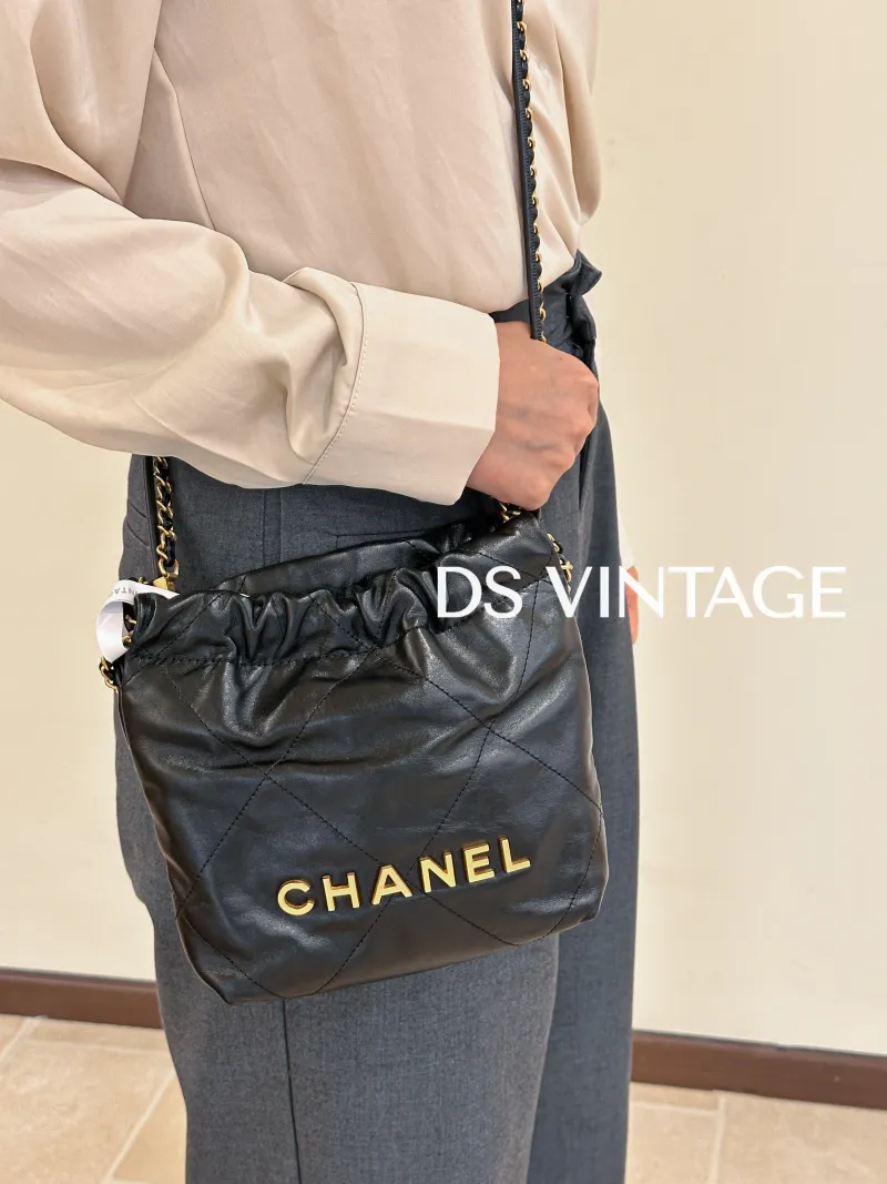 Chanel Shoulder Bag 22Bag Black CC alfskin Mini 20 × 6 × 19 cm — on-model view 1 of 3