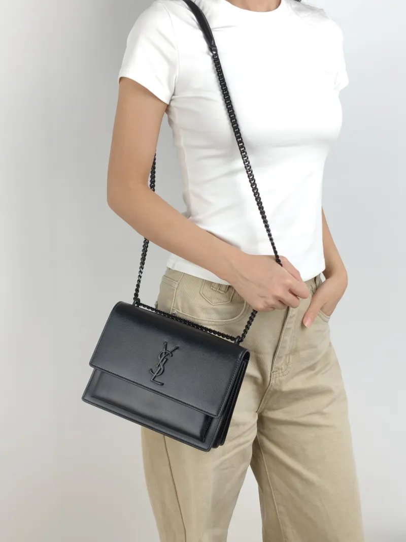 SAINT LAURENT Crossbody Bag SUNSET Black Calfskin Medium 22 × 6.5 × 16 cm — on-model view 1 of 3