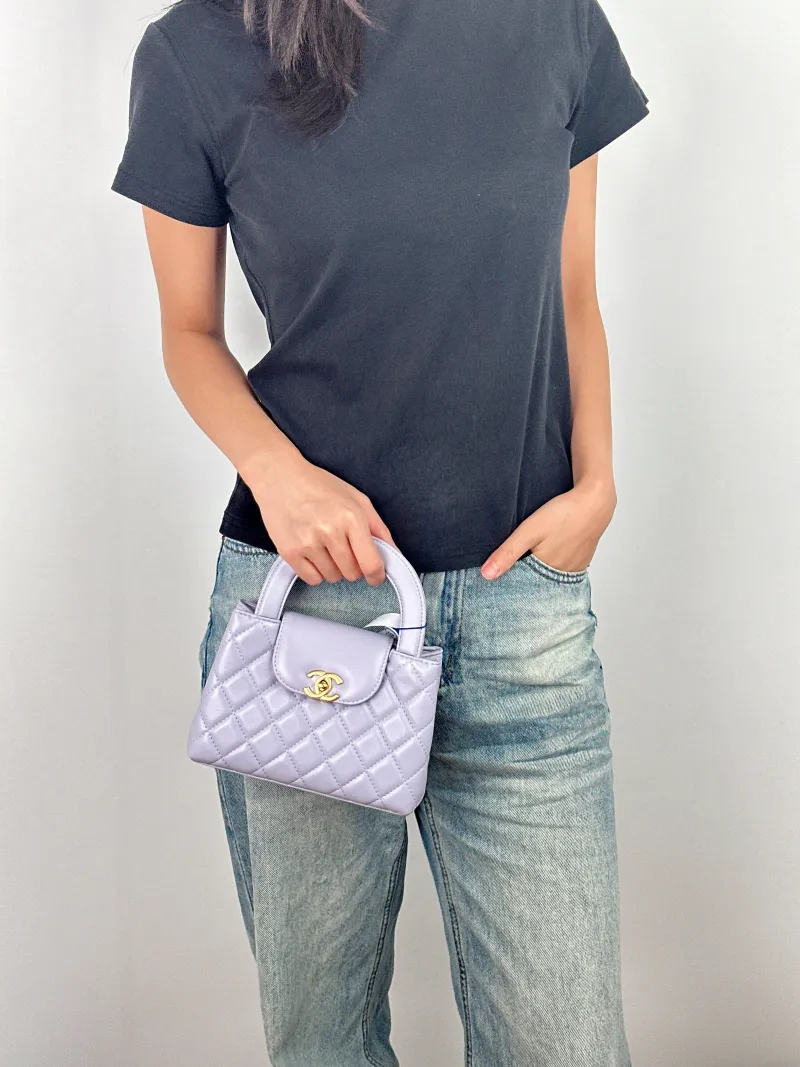 Chanel Crossbody Bag Kelly Lambskin Mini 19 × 7 × 13 cm — on-model view 2 of 3
