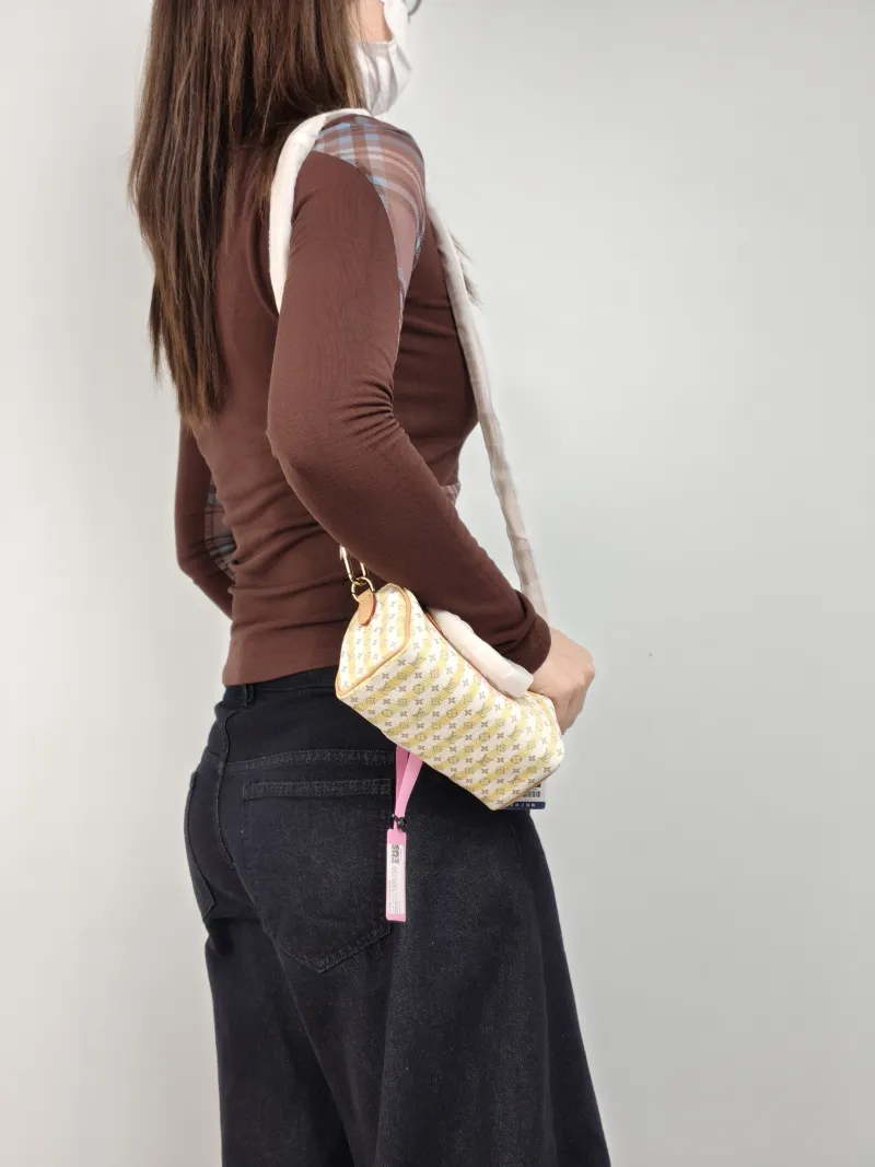 Louis Vuitton Crossbody Bag Speedy Nano White Yellow Monogram PVC nano 16 × 7.5 × 10 cm — on-model view 2 of 3