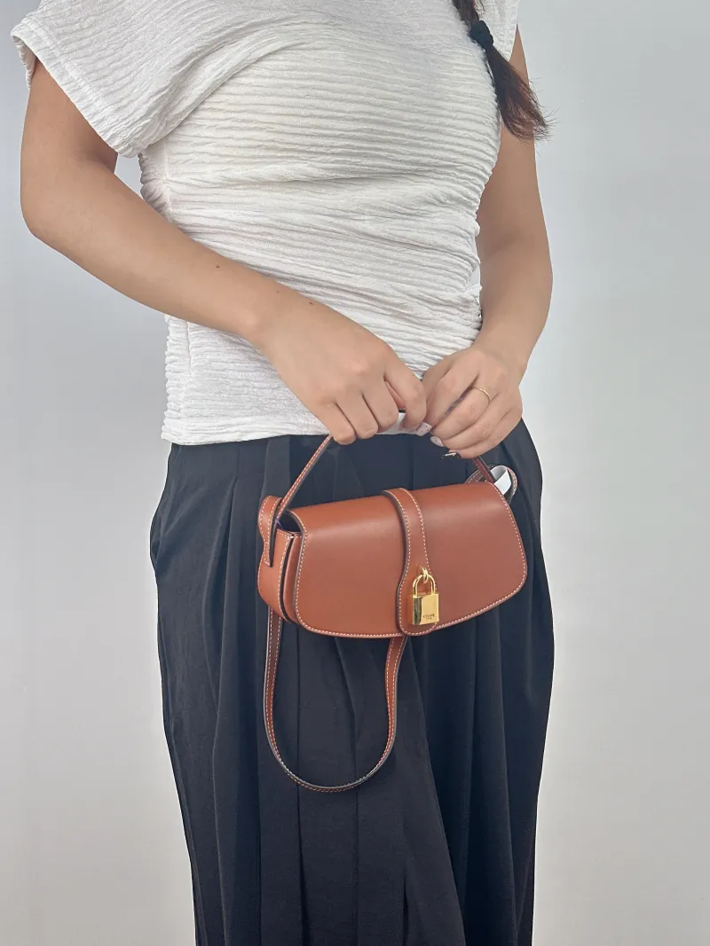 CELINE Crossbody Bag TABOU Brown Calfskinmini18 × 5 × 8 cm — on-model view 1 of 2