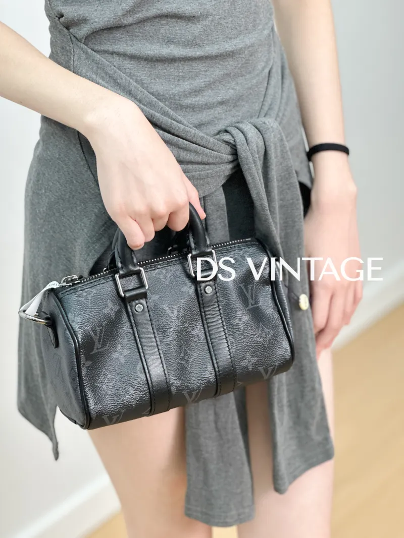 Louis Vuitton Crossbody Bag Keepall XS Monogram PVC Mini 21 × 9 × 12 cm — on-model view 4 of 6