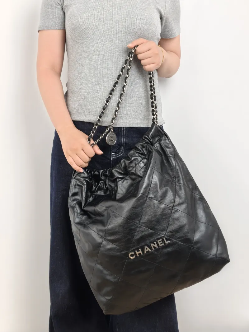 Chanel Shoulder Bag 22Bag Black CC alfskin Large 48 × 10 × 45 cm — on-model view 1 of 2