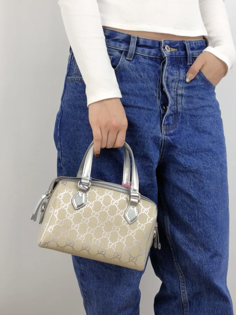 GUCCI Crossbody Bag GG Collection Silver Monogram PVC 20 × 11 × 13 cm — on-model view 2 of 2