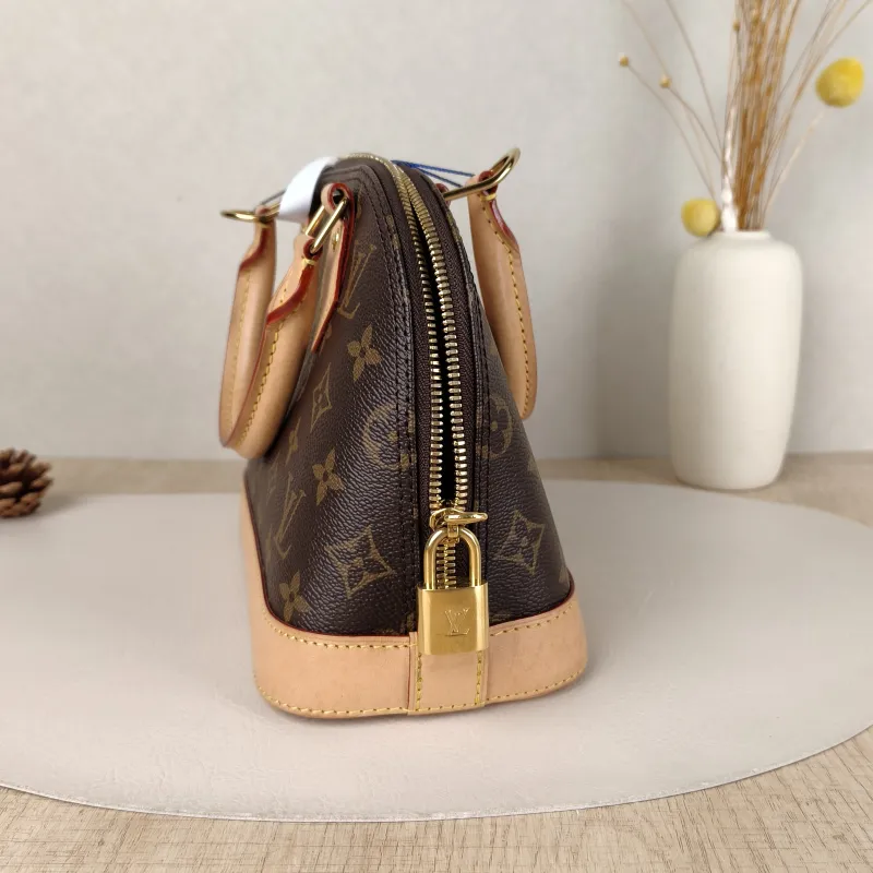 Louis Vuitton Crossbody Bag Alma BB Monogram PVCBB23.5 × 11.5 × 17.5 cm — detail view 13 of 14
