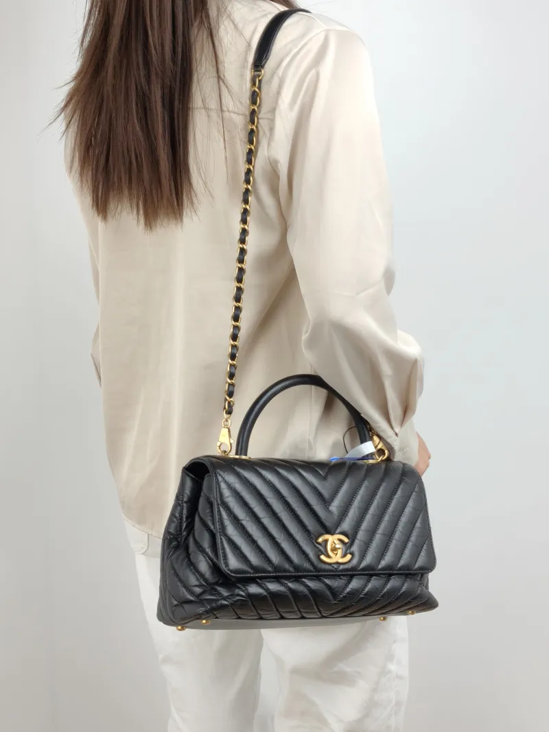 Chanel Top Handle Bag Coco Handle​ v Black Waxed Leather Calfskin Medium 29 × 12 × 18 cm 26 — on-model view 1 of 2