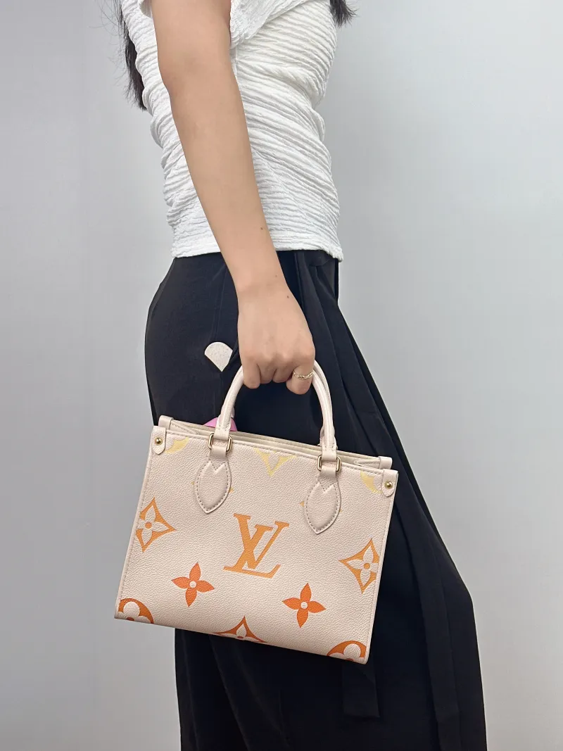 Louis Vuitton Shoulder Bag Onthego Beige Empreinte Embossed Calfskin Small 25 × 11.5 × 19 cm — on-model view 2 of 2