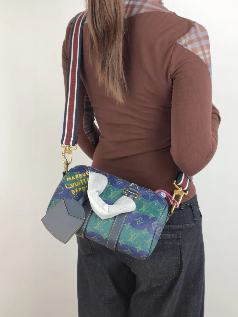 Louis Vuitton Crossbody Bag Keepall 25 Green Blue Monogram PVC Medium 25 × 11 × 15 cm — on-model view 1 of 3